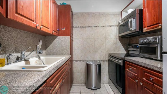 2804 NW 39TH WAY APT 102, LAUDERDALE LAKES, FL 33311, photo 4 of 33